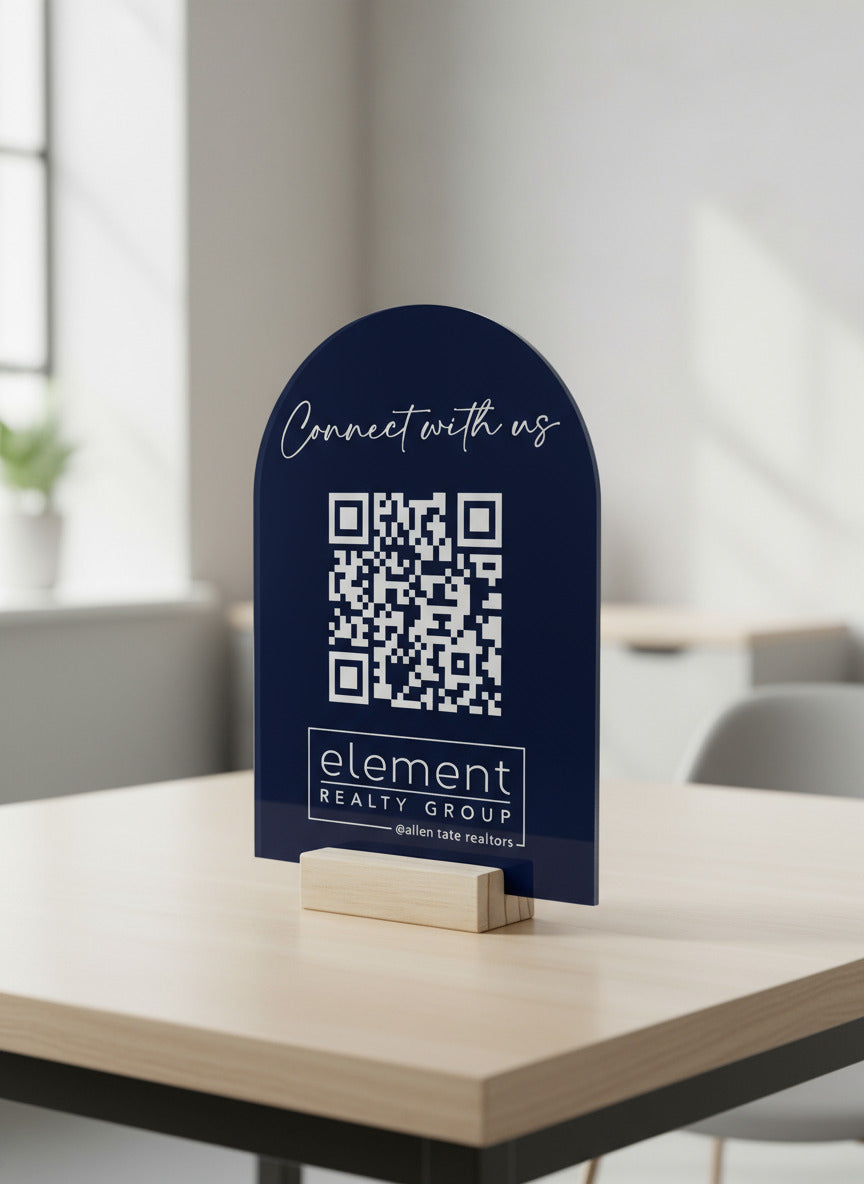 An arched acrylic QR code sign with the text 'Connect with us' and a QR code at the bottom. The sign is navy blue with white text and a white QR code.