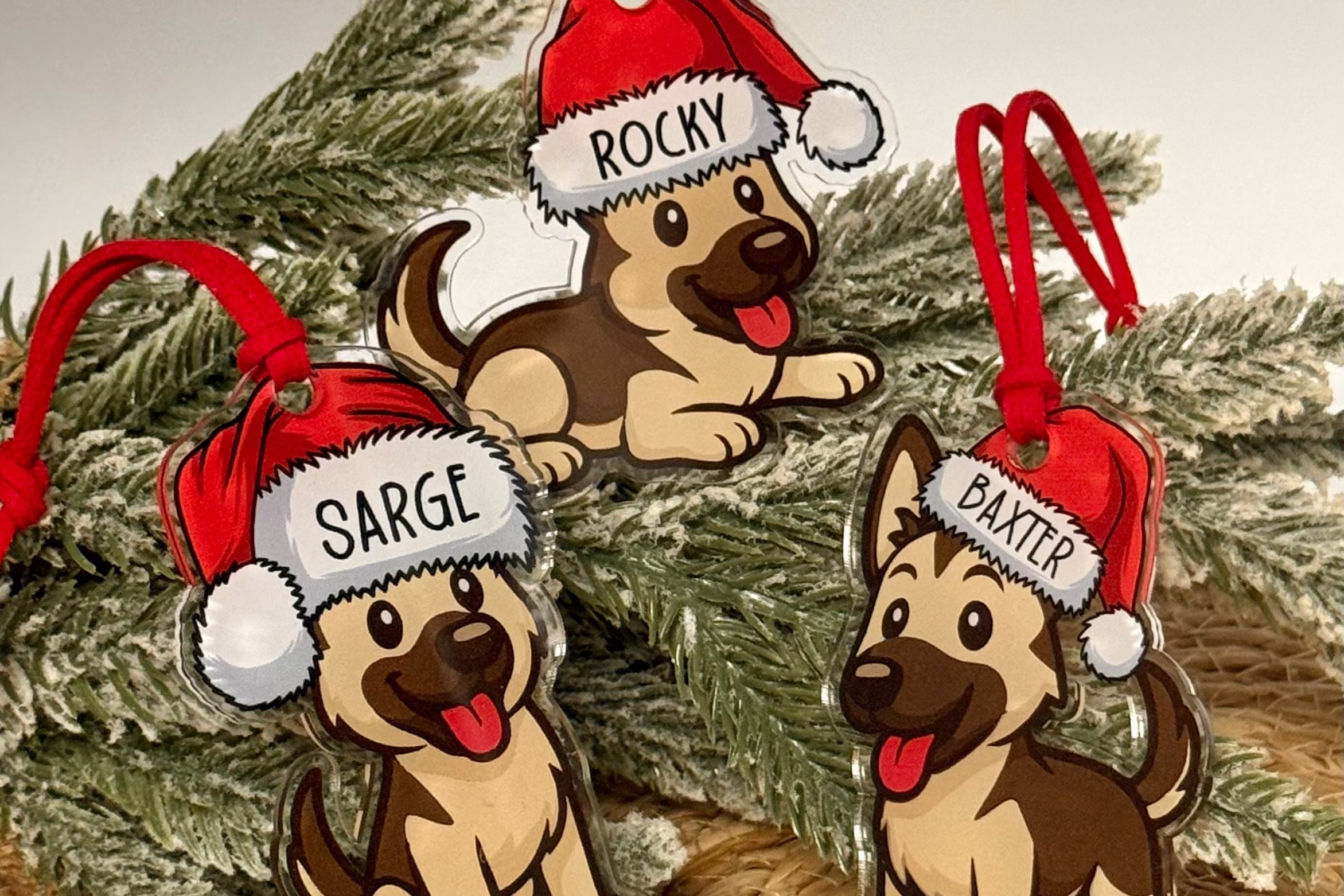 Three dog-shaped Christmas ornaments with red hats on a decorated tree.